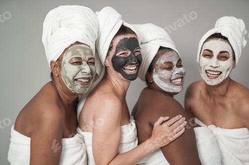 Preview: Multiracial women having fun doing beauty treatment
