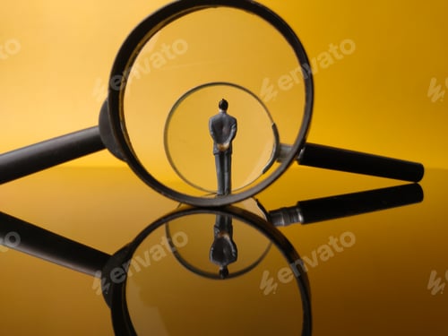 Preview: Miniature people center of a magnifying glass with reflection on a yellow background