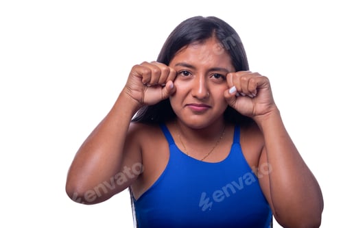 Preview: Dramatic woman making a crying face. Sad and crying black woman isolated on all white background.