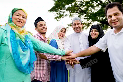 Preview: Muslim group of friends stacking hands