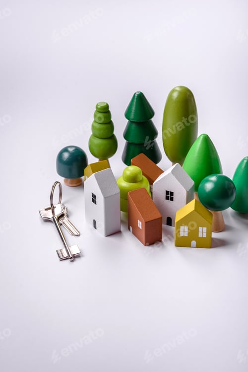 Preview: A small wooden house and keys as an idea for investing in your own home
