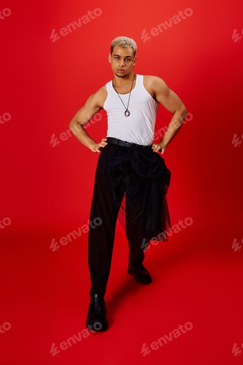 Preview: Dynamic fashion statement from a young African American man in a vibrant studio setting