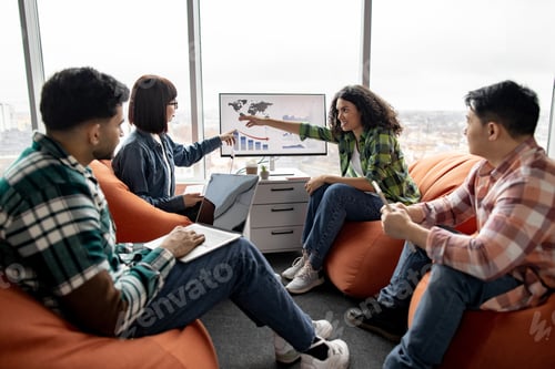 Preview: Specialists conducting data analysis on display in office