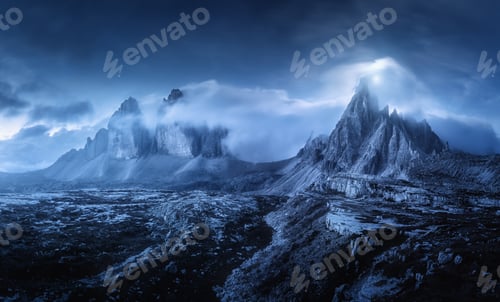 Preview: Mountains in fog at beautiful night. Dreamy landscape