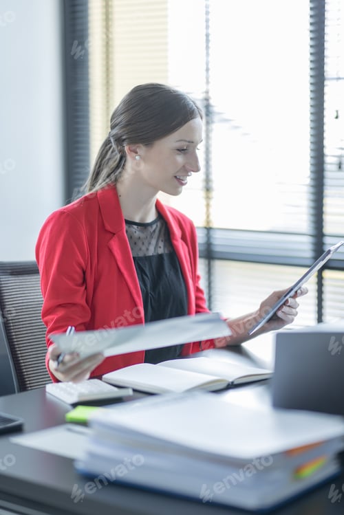 Preview: Businesswoman working calculator to check company finances and earnings and budget. Business woman c