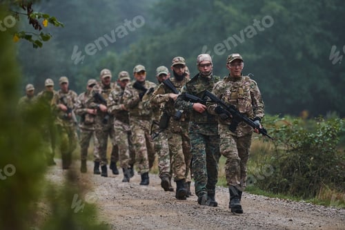 Preview: An elite military unit, led by a major, confidently parades through dense forest, showcasing