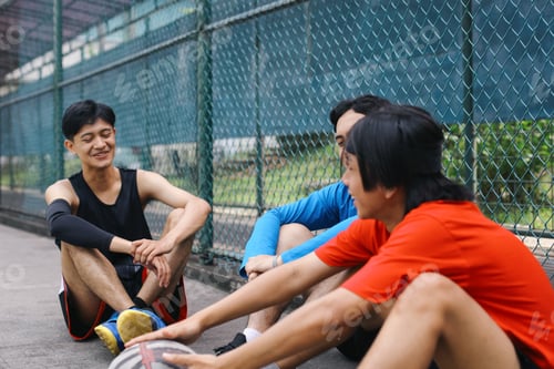Preview: Sporty Men Sitting on The Court