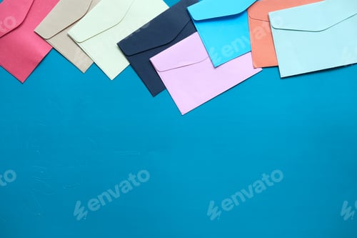 Preview: colorful envelope on green background with copy space.