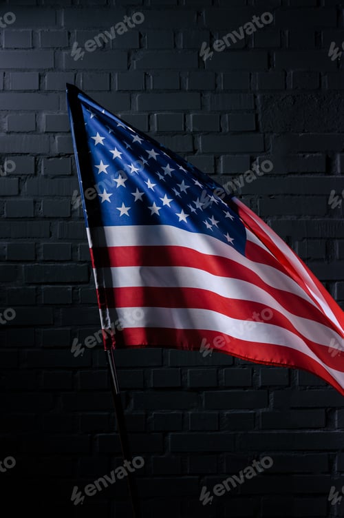 Preview: united states flag in front of black brick wall, Independence Day concept