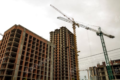 Preview: Ground view of a new modern residential house building under construction. Real estate development