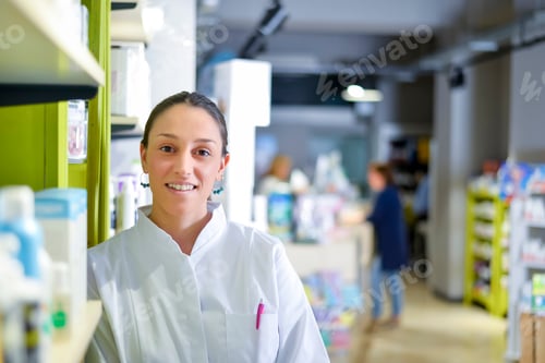 Preview: pharmacist chemist woman standing in pharmacy drugstore