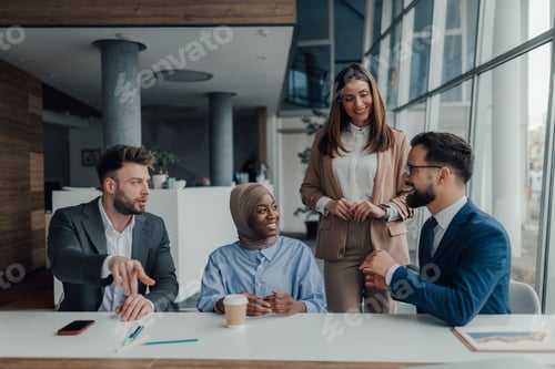 Preview: Business people collaborating during meeting in modern office