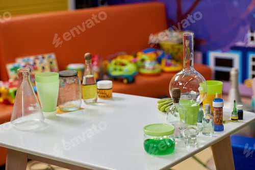 Preview: Laboratory glassware on table in playroom.