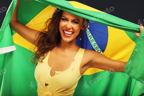 Preview: Happy Brazilian fan cheering with flag