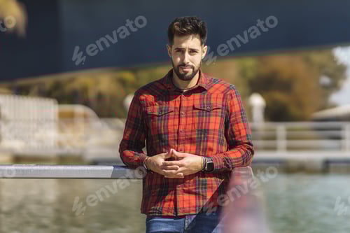Preview: Man Poses Wearing Plaid Shirt Outdoors