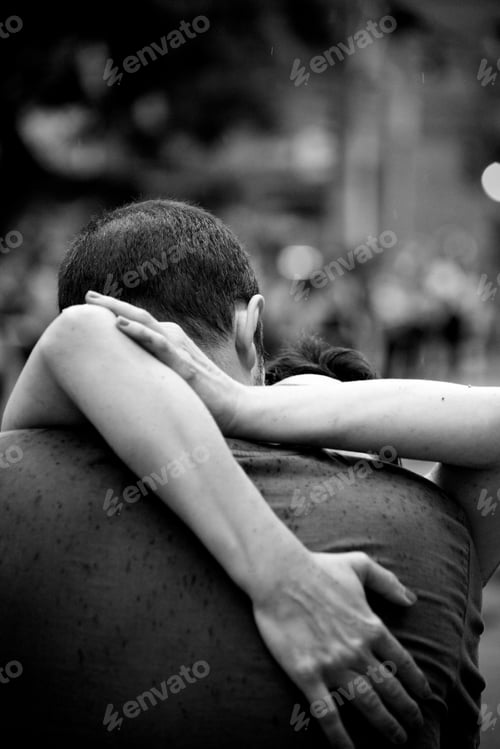 Preview: Grayscale of a passionate Brazilian couple hugging outdoors in Curitiba, Brazil