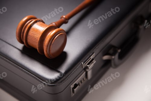 Preview: Gavel and Black Briefcase on Gradated Background with Selective Focus - Business Law Concept.