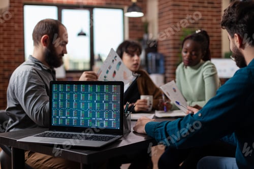 Preview: Diverse businesspeople discussing financial profit analyzing stock data