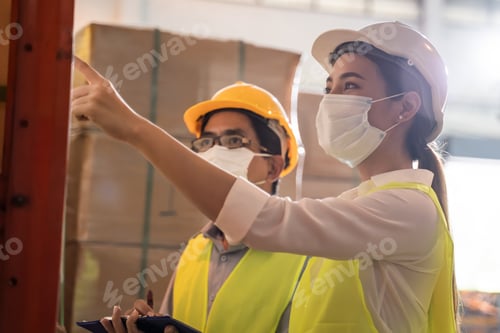 Preview: Man worker hold folder talking to woman in warehouse store.
