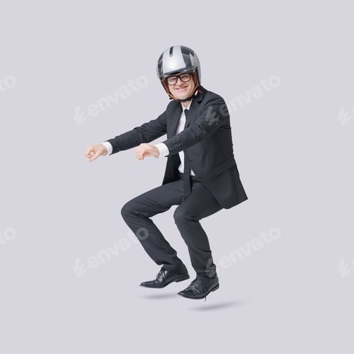 Vista previa: Happy businessman riding an imaginary motorbike