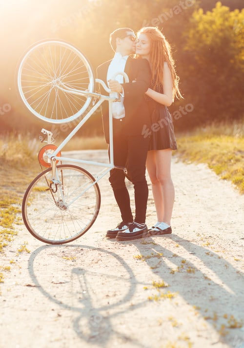 Preview: Guy with the girl and bicycle outdoors