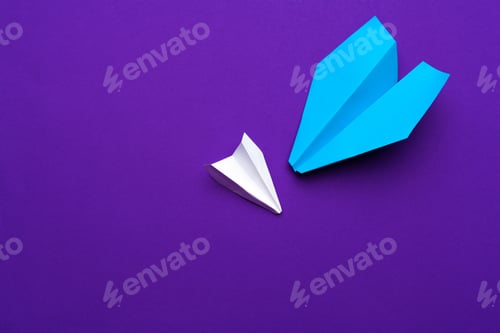 Preview: white paper airplane on a purple background