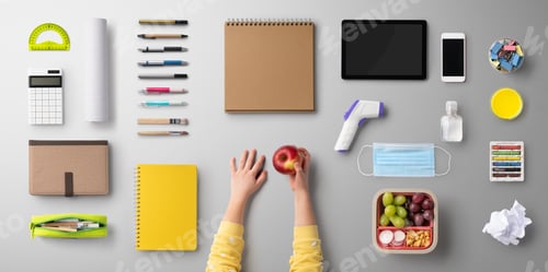 Preview: Flat lay top view of face mask and school supplies, back to school and coronavirus concept.