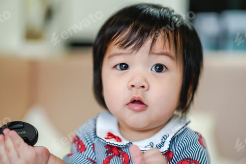 Preview: Portrait of baby cute girl on the bed.