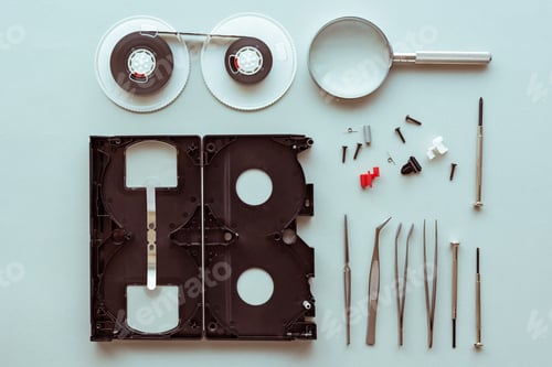Preview: Flat lay vhs video cassette parts on pastel blue background