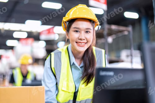 Preview: Worker working in the large depot storage warehouse happy smiling packing box at cashier counter