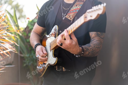 Preview: Man Plays Electric Guitar in Outdoor Setting