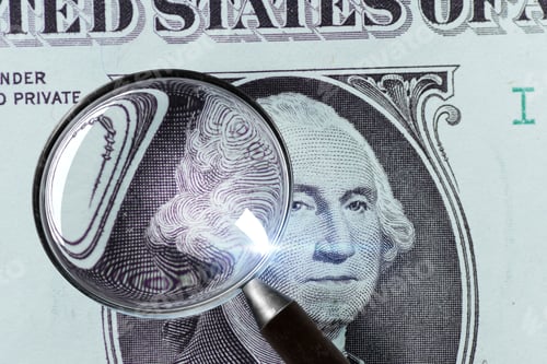 Preview: 1 US Dollar under magnifying glass