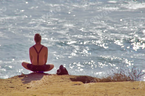 Preview: Man doing yoga, waiting for the sunset