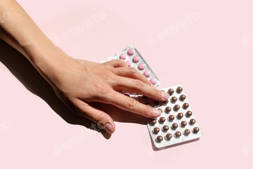 Preview: Woman Hand Reaching for Blister Package of Dietary Supplement Pills.