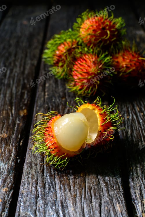 Preview: Close up of rambutan on old wood table