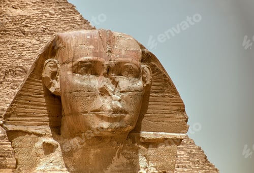 Preview: Majestic sphinx sculpture stands guard in front of the iconic pyramids of Giza, Egypt.