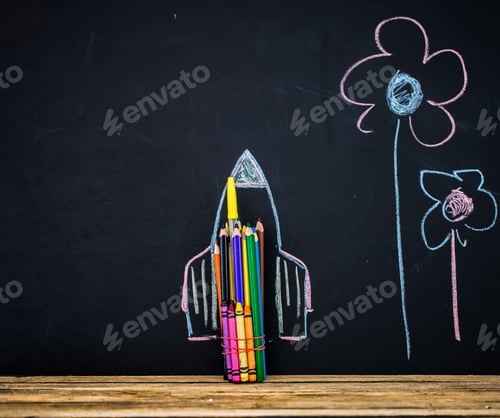 Preview: Back to school black background the missile made with pencils, drawing crayons books