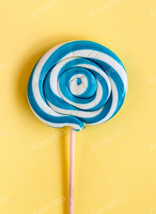 Preview: Colorful lollipops and different colored round candy. Top view.