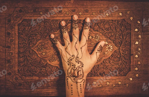 Preview: Woman's hand with traditional menhdi henna ornament