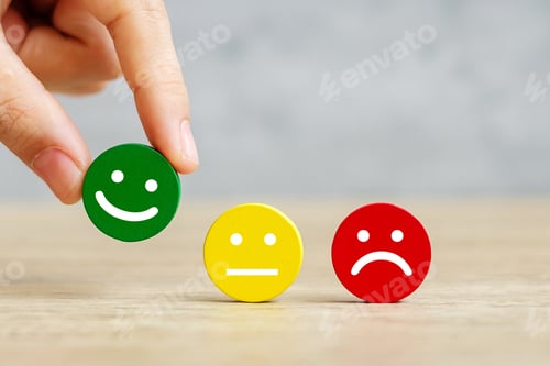 Preview: hand holding emotion face block. Customer choose Emoticon for user reviews. Service rating, ranking