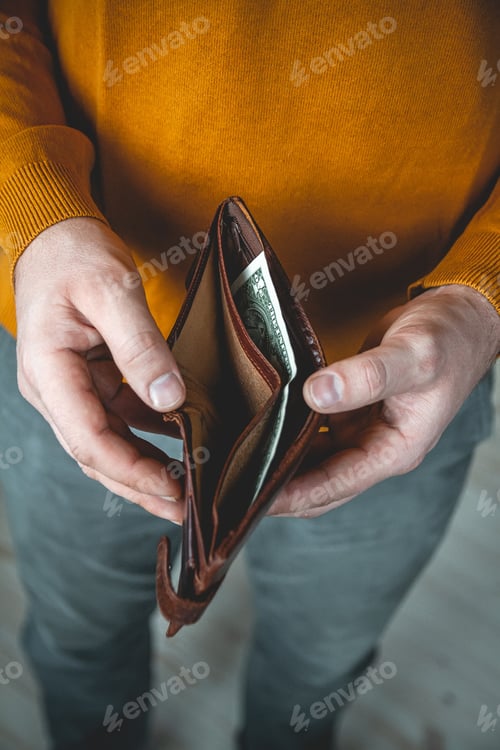 Preview: Empty wallet in the hands of a young man