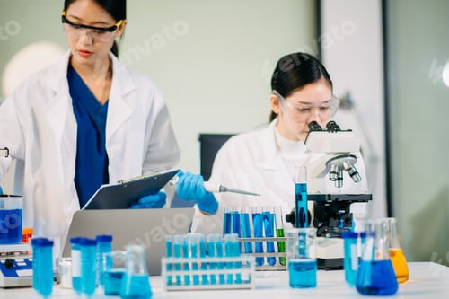 Preview: Scientist team meeting and writing analysis results in the laboratory study