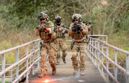 Preview: Group of military or soldier team with battle suit walk on the bridge near flare firework