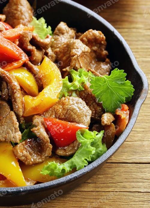 Preview: traditional mexican dish fajitas meat with vegetables
