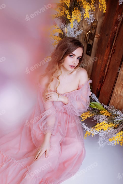 Preview: Woman in Pink Dress with Yellow Flower Arrangement