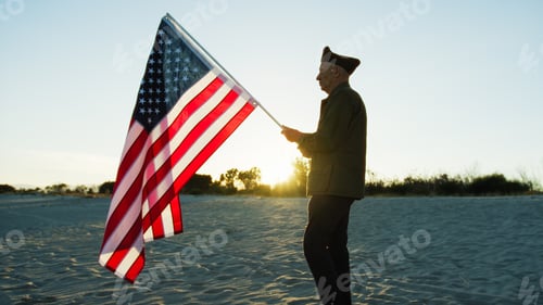 Preview: Old Veteran walking in the beach alt sunset with Usa Flag