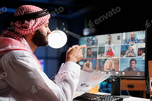 Preview: Man discussing with team on video call