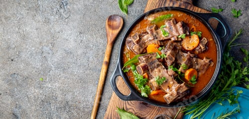 Preview: Beef ribs Bourguignon. Beef ribs stewed with carrot, onion in red wine. France dish. Top view