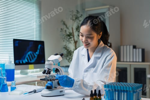 Preview: Asian scientist woman researching DNA using microscope in laboratory