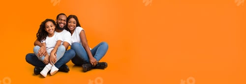 Preview: African American family posing sitting on the floor, panorama